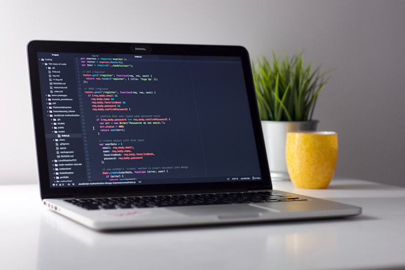MacBook with Next.js code open on a bright desk